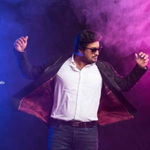 portrait of a man in blue background